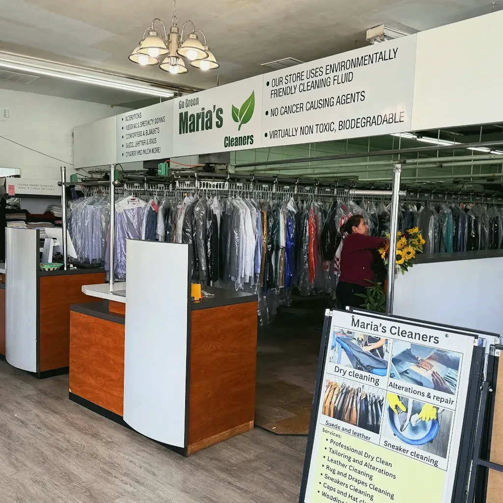 Inside Maria's Cleaners, with the Go Green sign above the front counter
