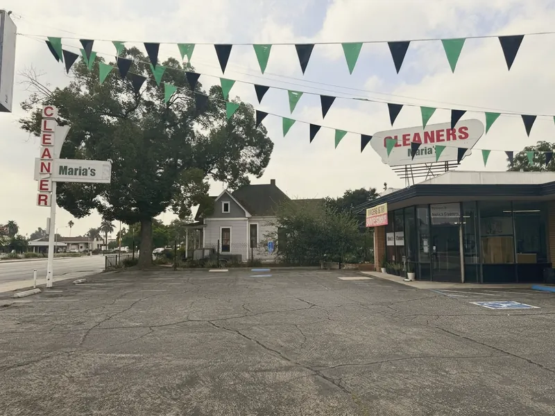 Green and black pennants strung over the shop's parking lot