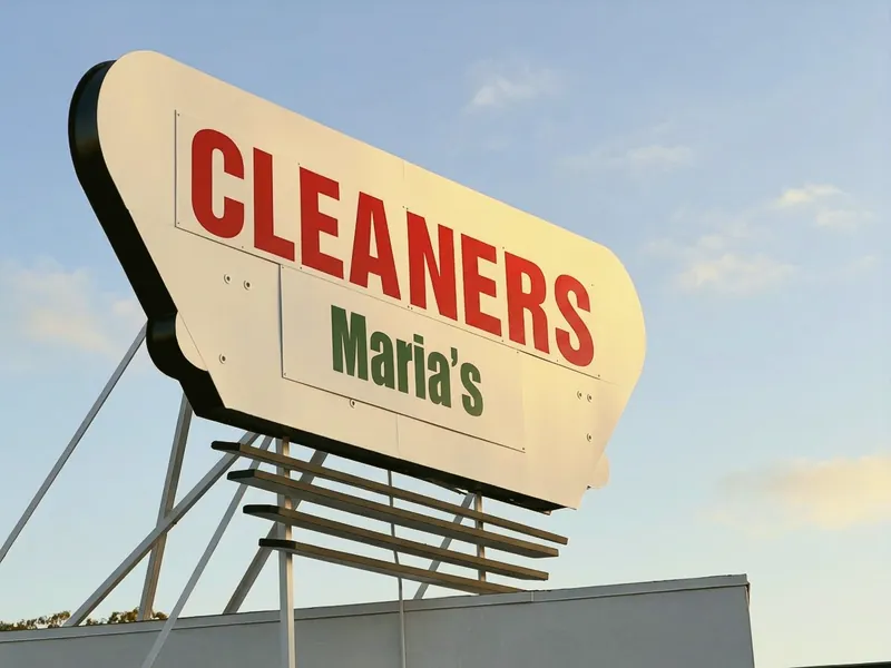 The retro rooftop sign reading Cleaners, Maria's